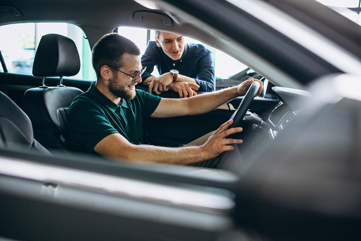 Young man testing new car